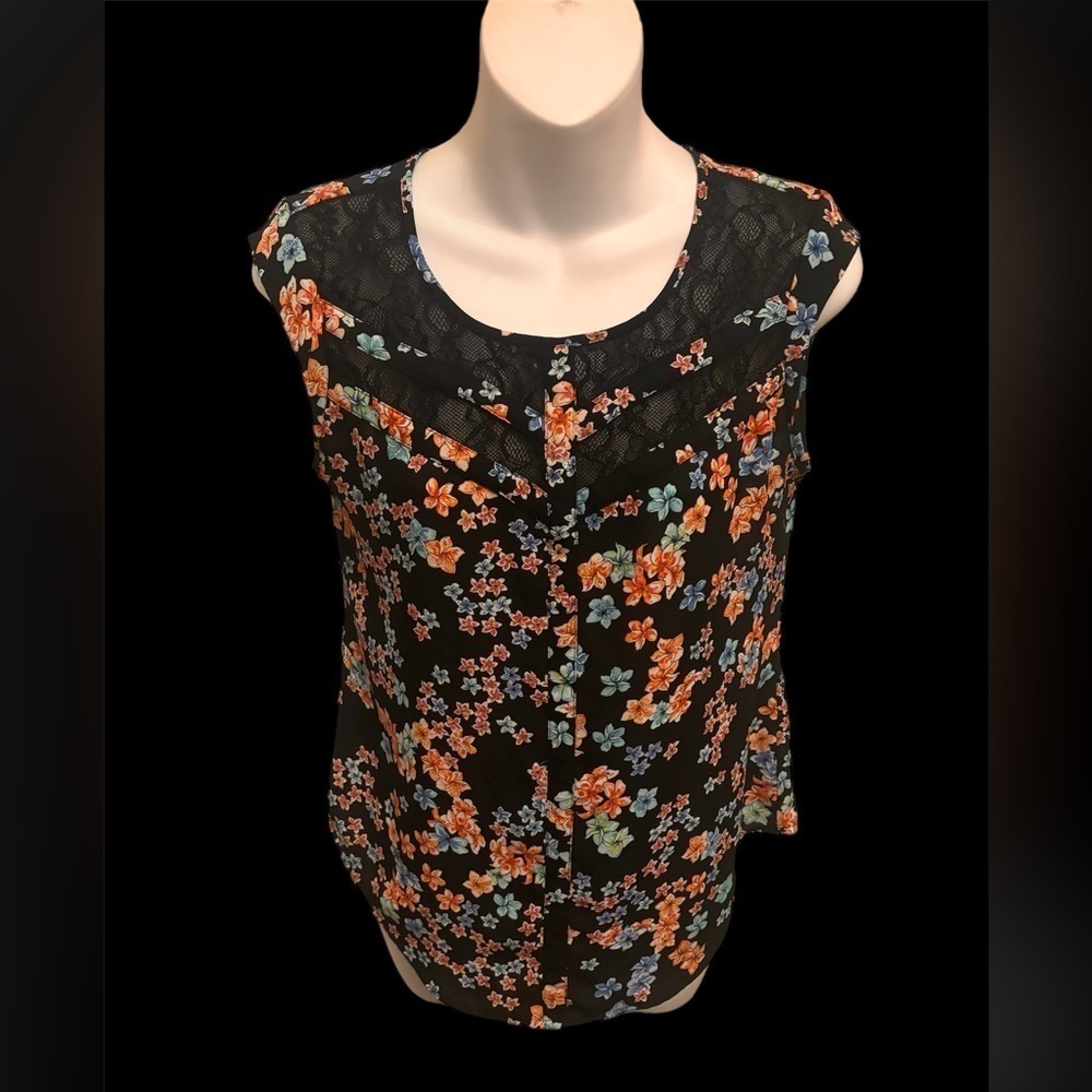 Candie’s size small floral tank. Black with vibrant flowers Very gently used.